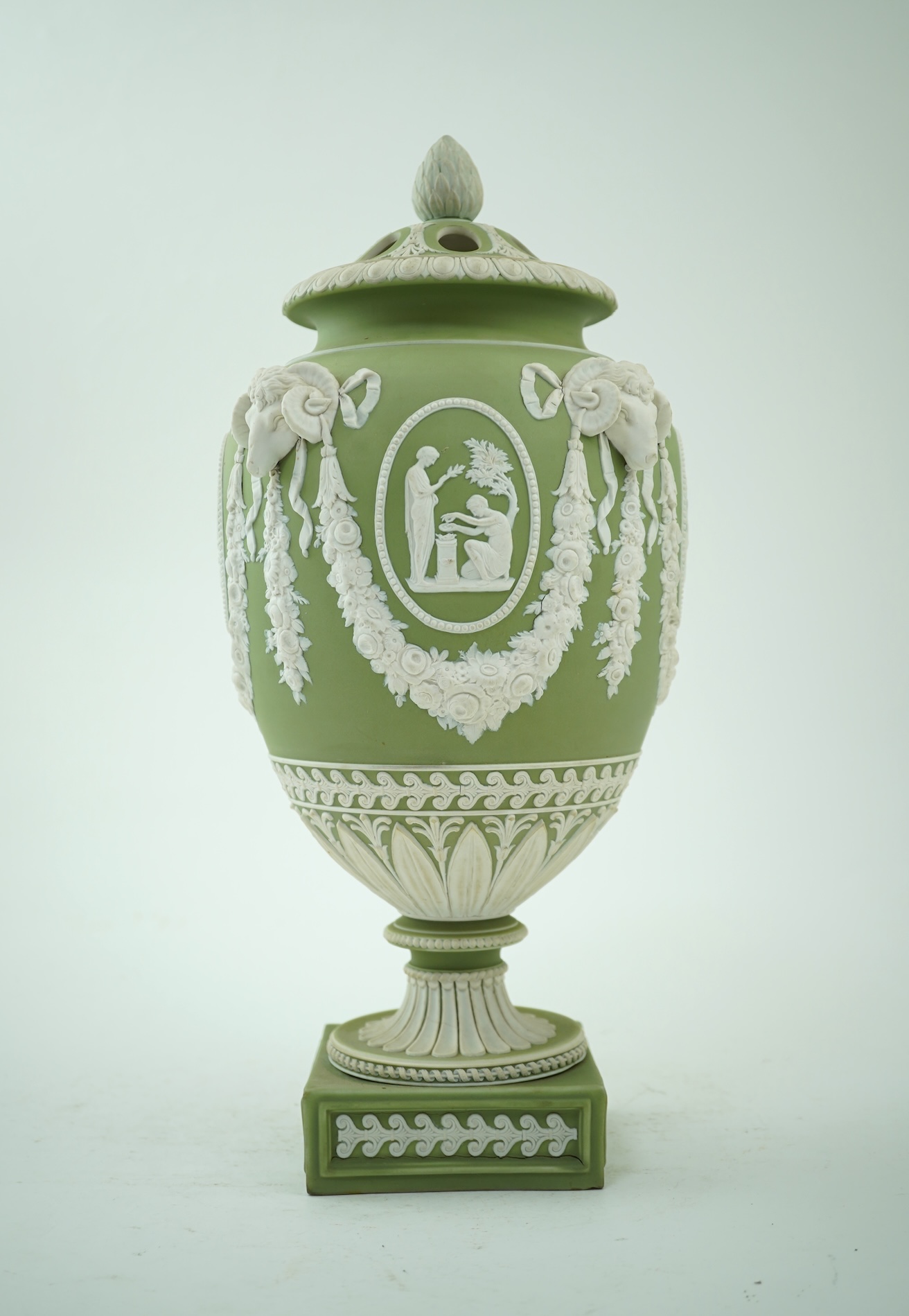 A Wedgwood green jasperware covered pot pourri urn, early 19th century